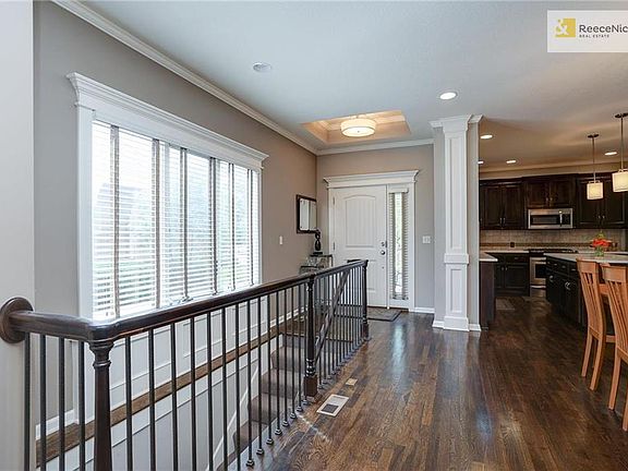 Light filled entry opens to main level and stairs to lower level.