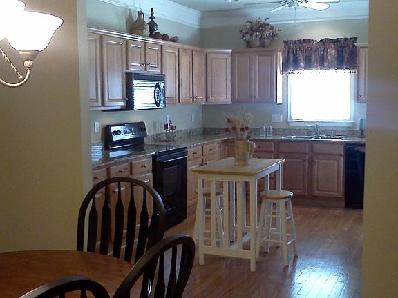 Open plan showing view from Dining to Kitchen.