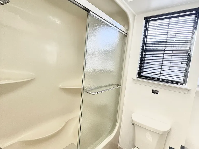 Shower & toilet area of the bathroom with a separate door for privacy