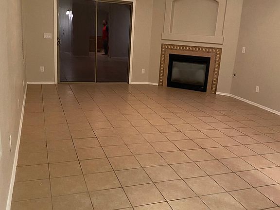 Family Room w/Fireplace View and Sliding Glass Door Leading to Back Yard
