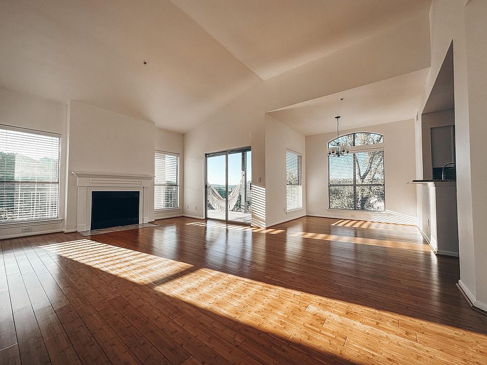 High ceilings and wood-burning fireplace.