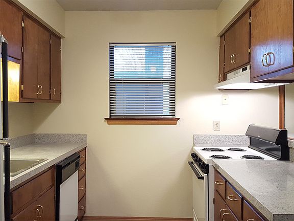 Kitchen includes range, dishwasher and full size refrigerator.
