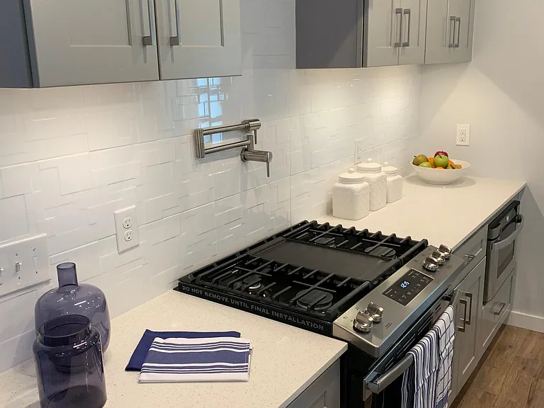 STAINLESS GAS RANGE/OVEN WITH POT FILLER AND VENTED STAINLESS HOOD