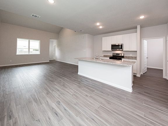 Kitchen to Dining Area and Family Room