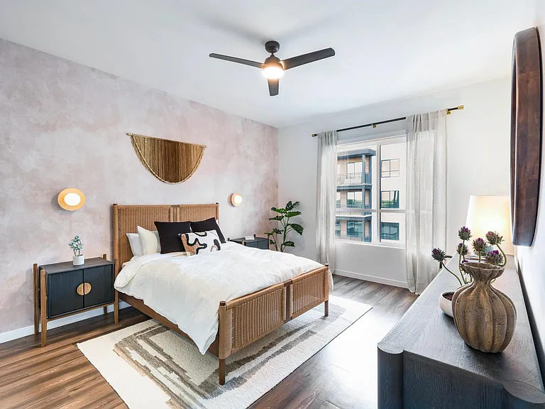 Sunlit and stylish, this bedroom at Modera Higley Commons blends natural warmth with refined design for a truly inviting retreat.