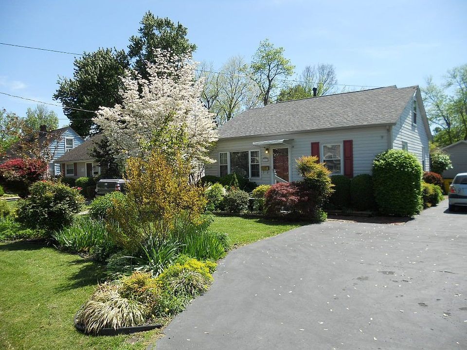 Beautiful landscape & freshly painted shutters and front door.