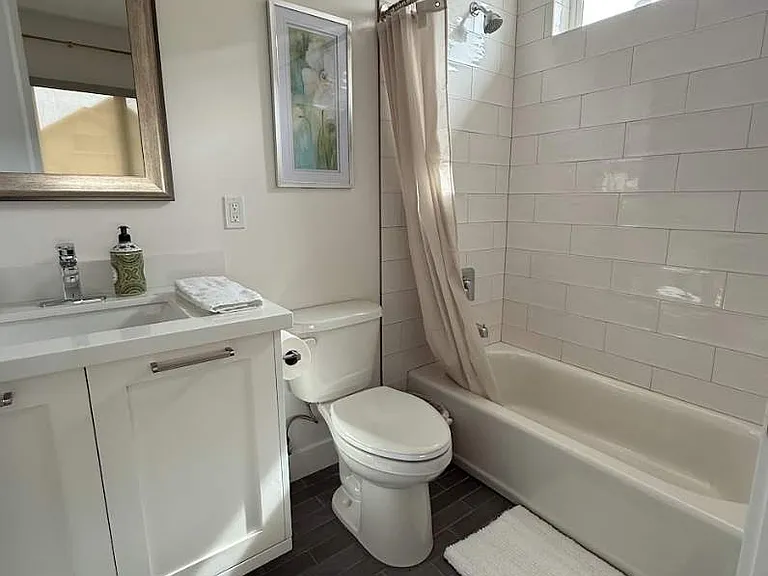 Full bathroom with tub and shower.
Walk in closet would be on the left side of this photo