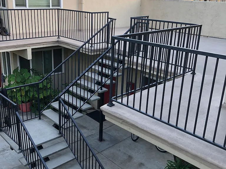The upstairs patio may be used for spontaneous outdoor dining with your own portable chairs/ furnishings. Stairs to laundry.