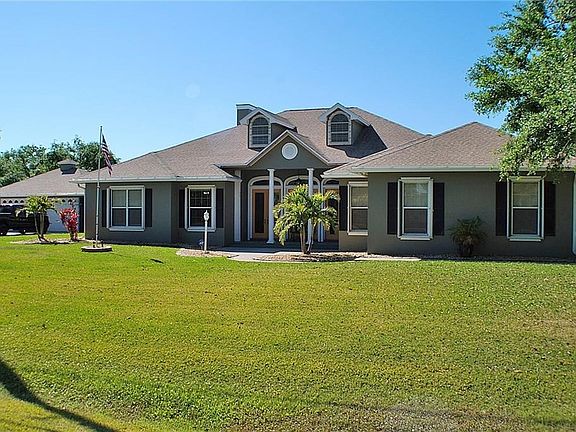 This home has a two car attached garage and a two car detached garage