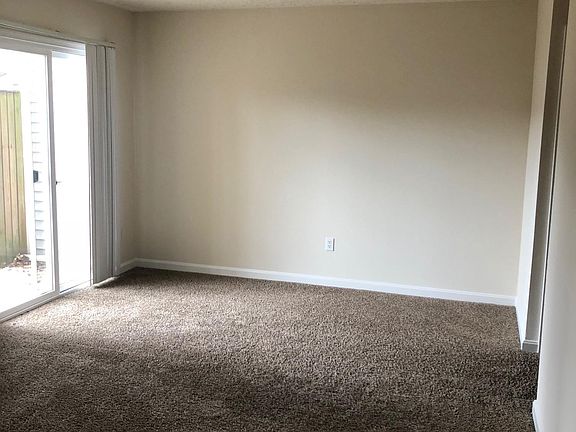 Large living room with walk out terrace to fenced back yard