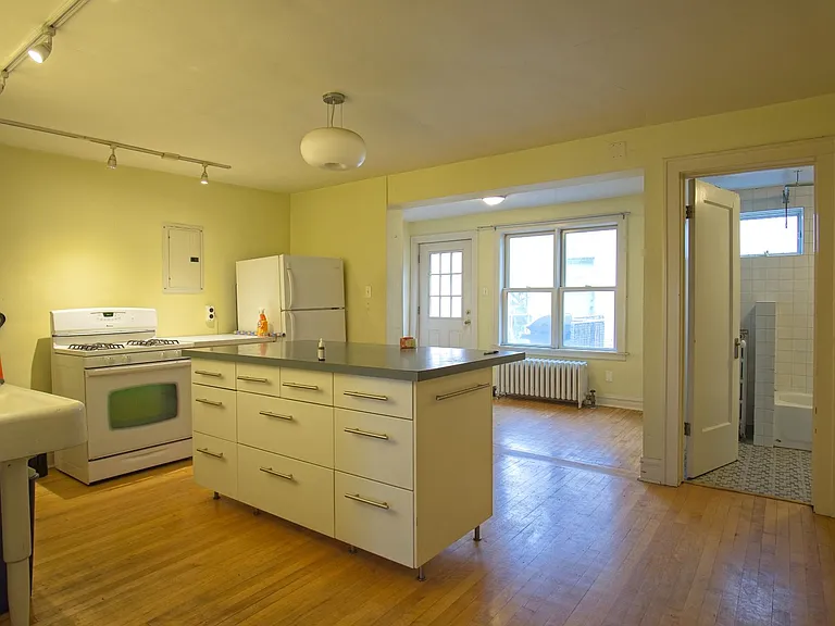 Kitchen with sunroom beyond