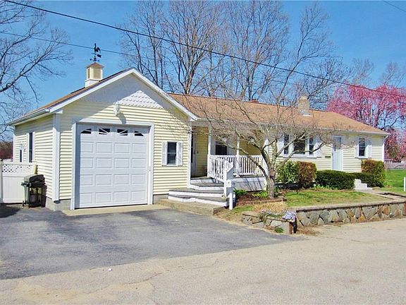 Cozy Front Porch & 1 Car Attached Garage with Plenty of Parking!