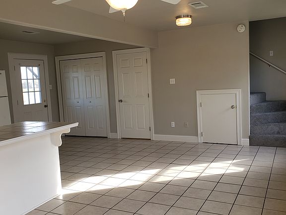 Washer/Dryer hook-ups behind double doors. 1/2 bath behind single door