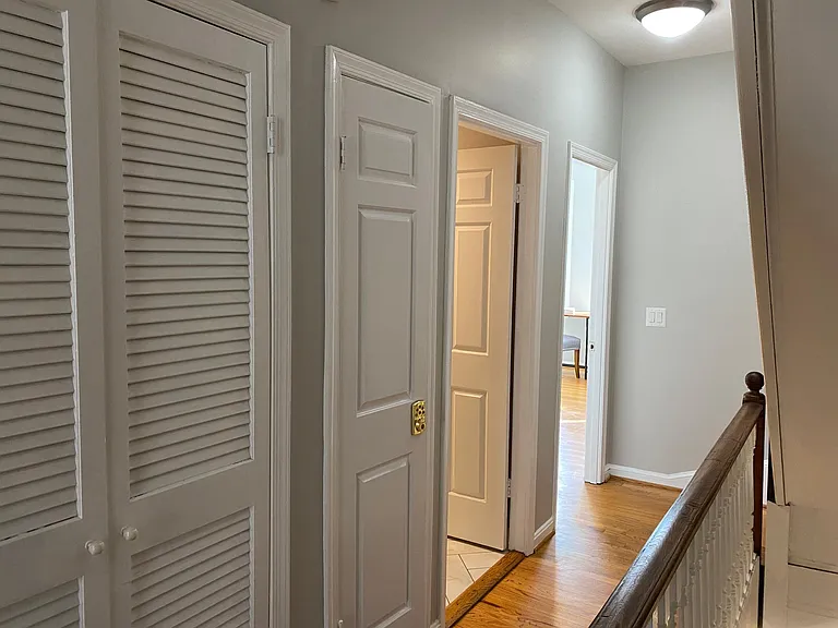 2nd floor landing with 2 bedrooms, full bath #3, linen closet and laundry room.