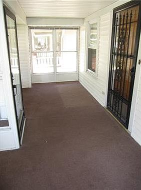 ENCLOSED PORCH ON FRONT OF HOME