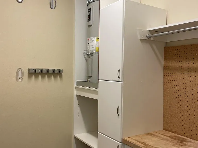 Laundry, storage, and work room