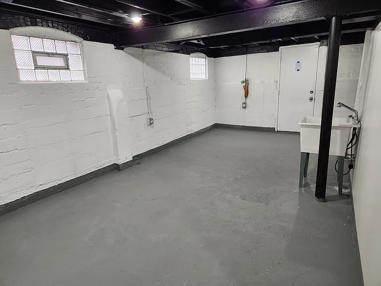 Basement with washer dryer hook up and utility sink