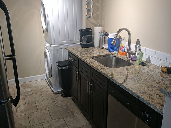In-unit washer/dryer located in the kitchen.