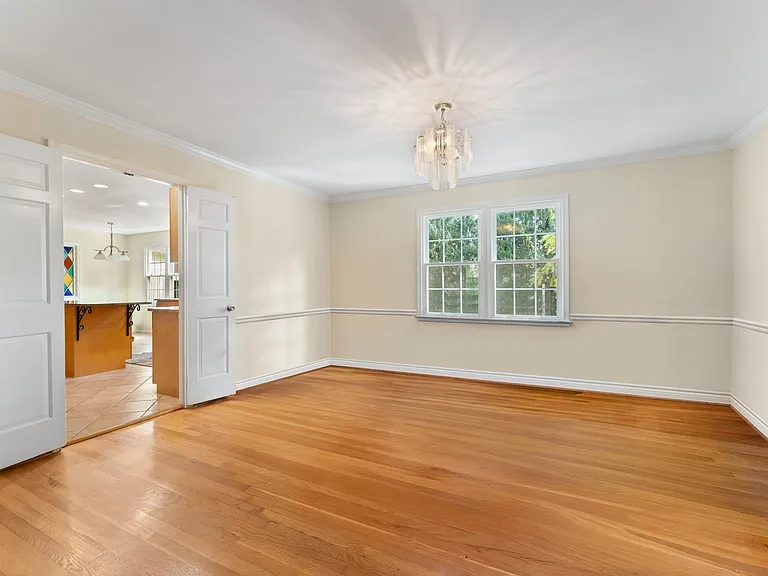 Large separate dining room with chandelier