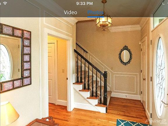 Step inside the leaded glass front door to find nine foot ce