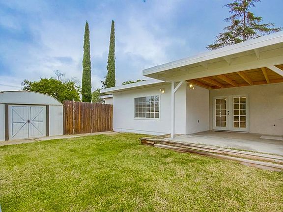 Enclosed portion of back yard, large covered patio, storage 