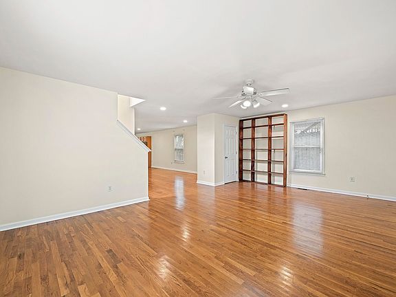 Large living room with a cozy bookcase for added charm