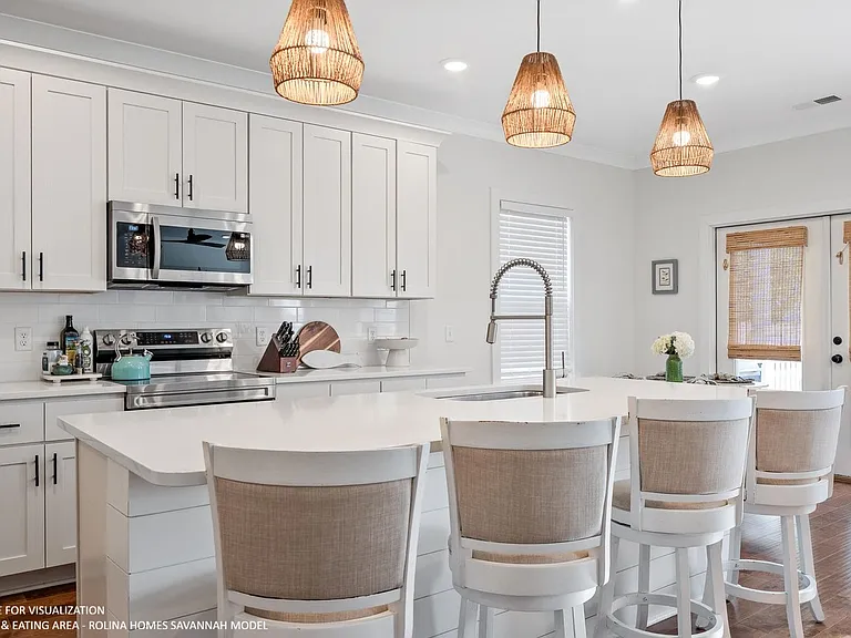 KITCHEN PICTURE FROM A DIFFERENT SAVANNAH MODEL RECENTLY BUILT BY ROLINA HOMES