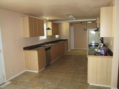 Lot's of counterspace and new travertine tile floors.