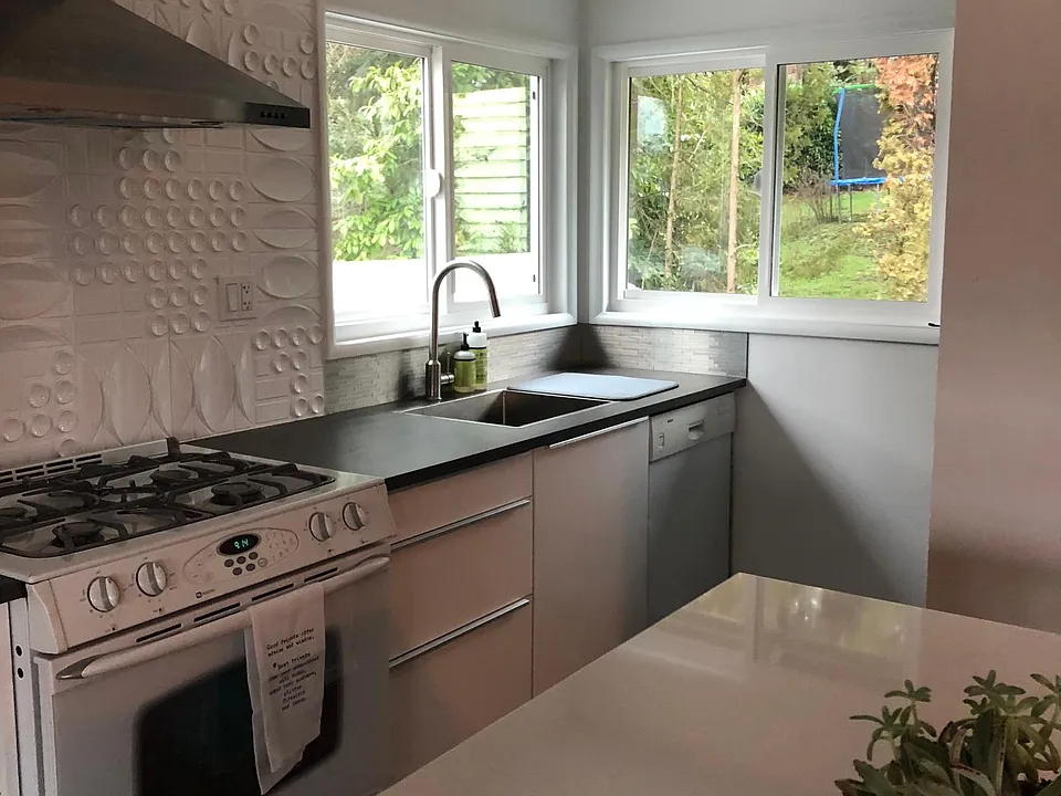 Kitchen with gas range, dishwasher and island