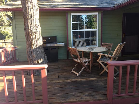 Front porch with seating area and bbq