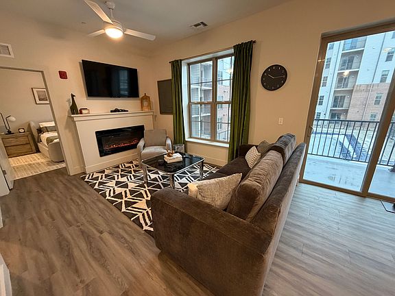 Modern living room with fireplace and balcony
