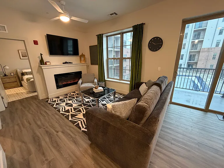 Modern living room with fireplace and balcony