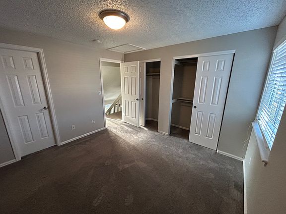 Master bedroom with door to bathroom, double closet