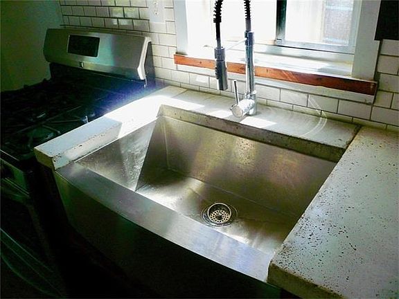 Farmhouse sink with commercial grade faucet.