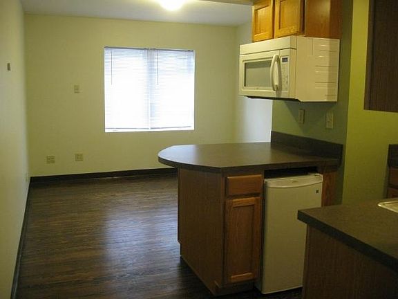 Kitchen area on right, living space in back