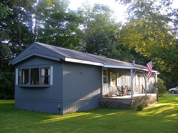 front view with deck and peaked roof