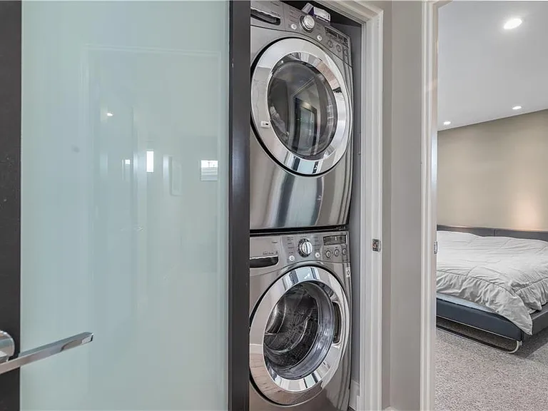 Stackable washer/dryer is located on the main floor