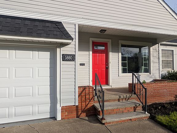 Enjoy a cute front covered porch with built in planters