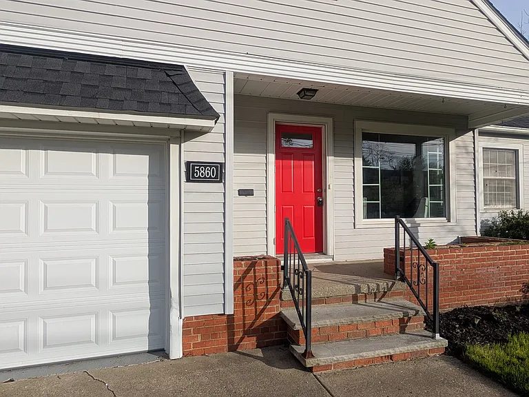 Enjoy a cute front covered porch with built in planters
