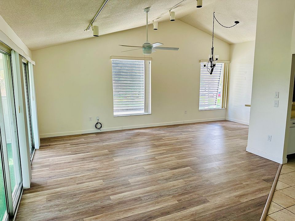 Open living room and dining room with vaulted ceilings