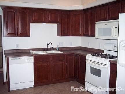 Kitchen
						:
						Appliance side of the kitchen, not seen is an island and desk area with cabinets