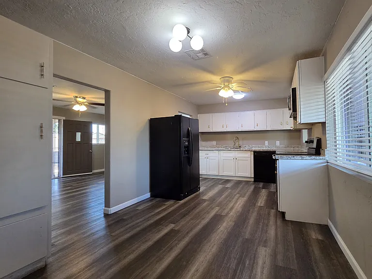 Kitchen includes refrigerator, dishwasher, built-in microwave, and stove. You have a view of the pantry/shelf space to the left.