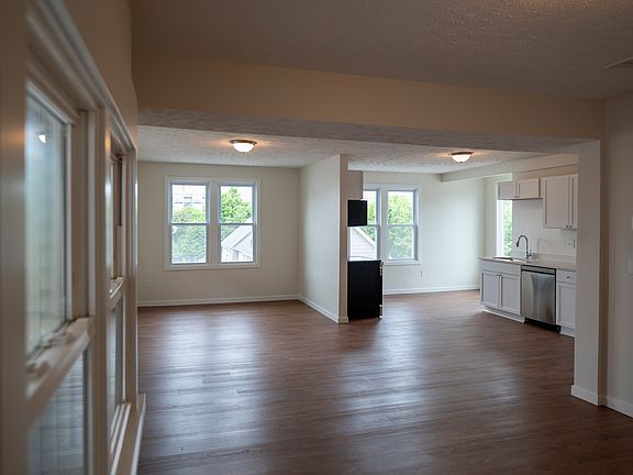 Open concept kitchen, living, dining area.