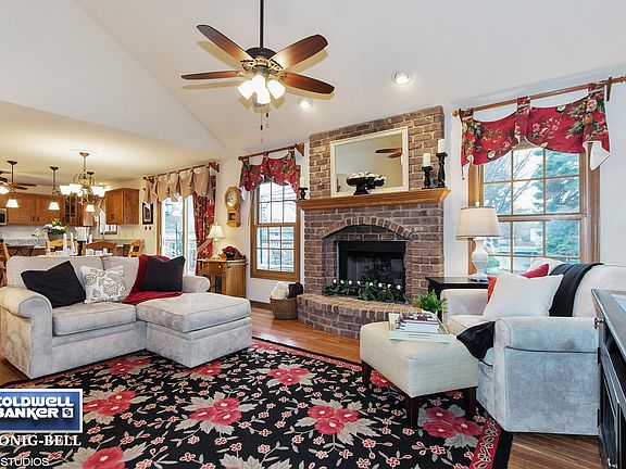Cozy great room area features a gas fireplace.