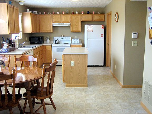 Large Kitchen with center island work station and bayed window