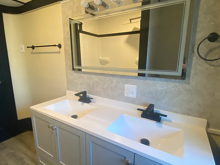 second floor bathroom sink and mirror.