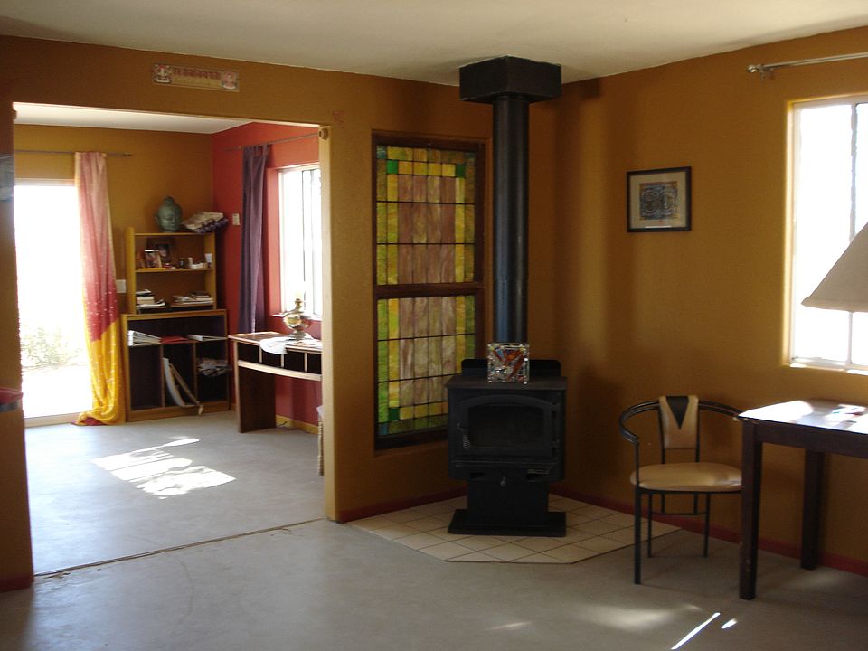 wood stove with glass door and stained glass