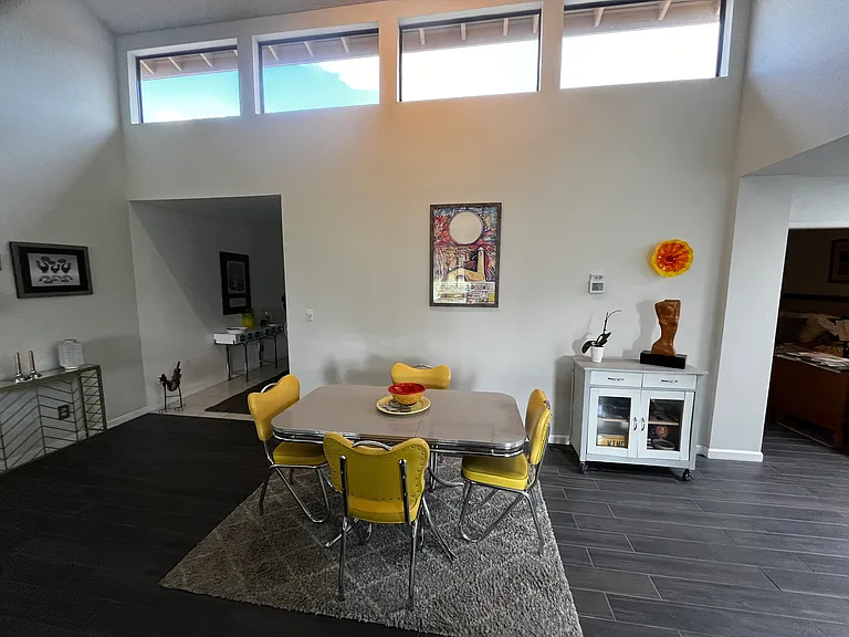 Dining area facing entry-way to condo