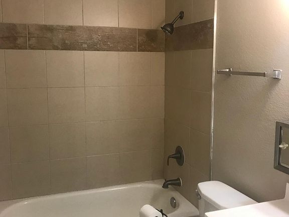 Tiled tub surround and new vanity