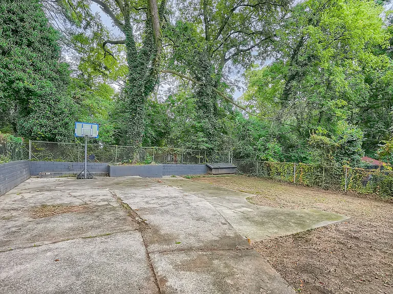 Large backyard with basketball hoop